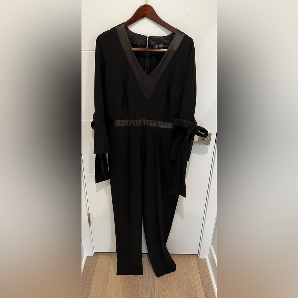 Black pant jumpsuit with ties on arms by Eloquii